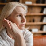 middle aged mature woman relaxing on the couch sofa
